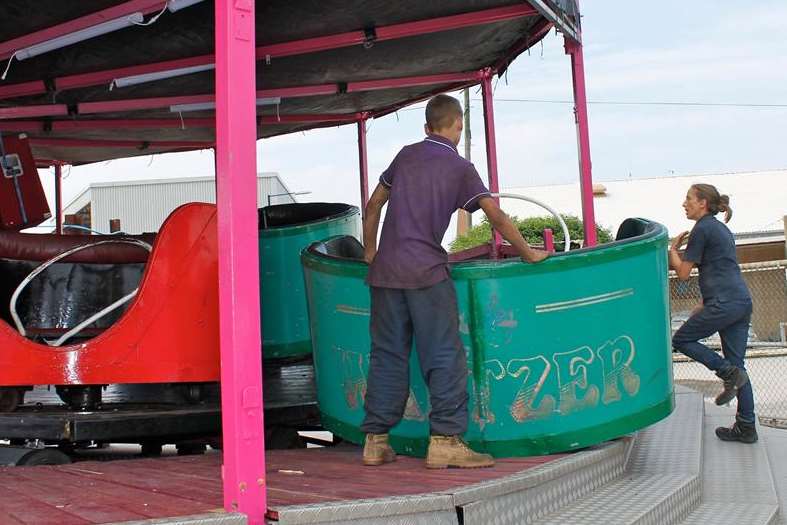 Fairground workers with the derailed Waltzer in Whitstable