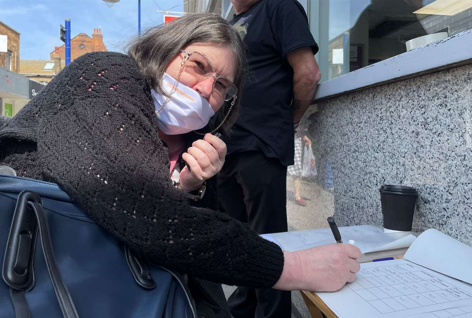 Pauline Field signs the petition to keep TSB on Sheppey. Picture: Joe Crossley