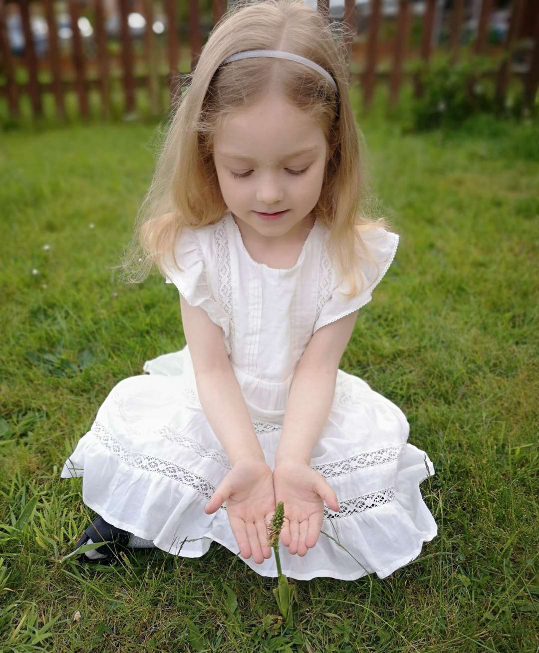 Angelica's daughter Alisa with the rare orchid. Photo: Angelica Djacenko