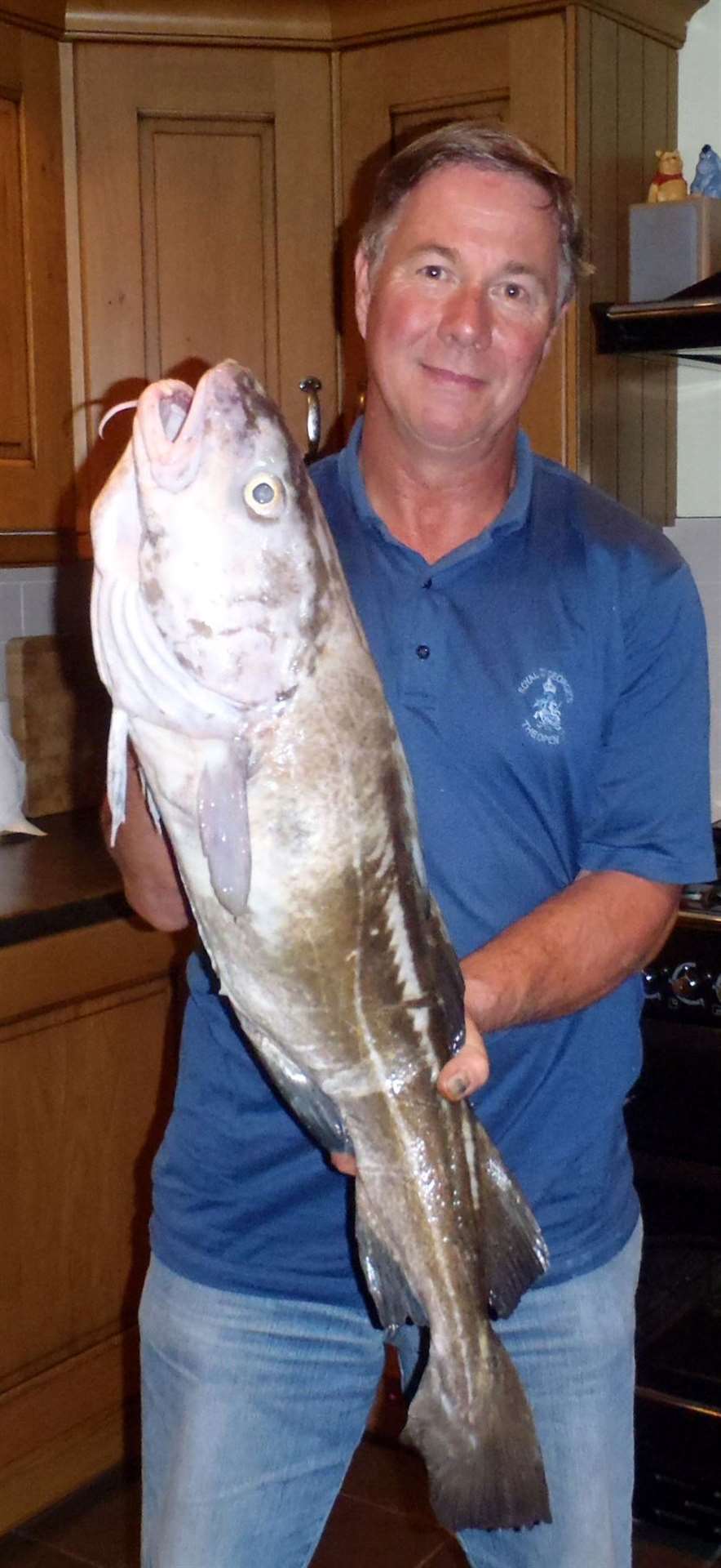 Mark Hopson with the 14lb cod he caught from the pier in Dover Picture: Alan Yates