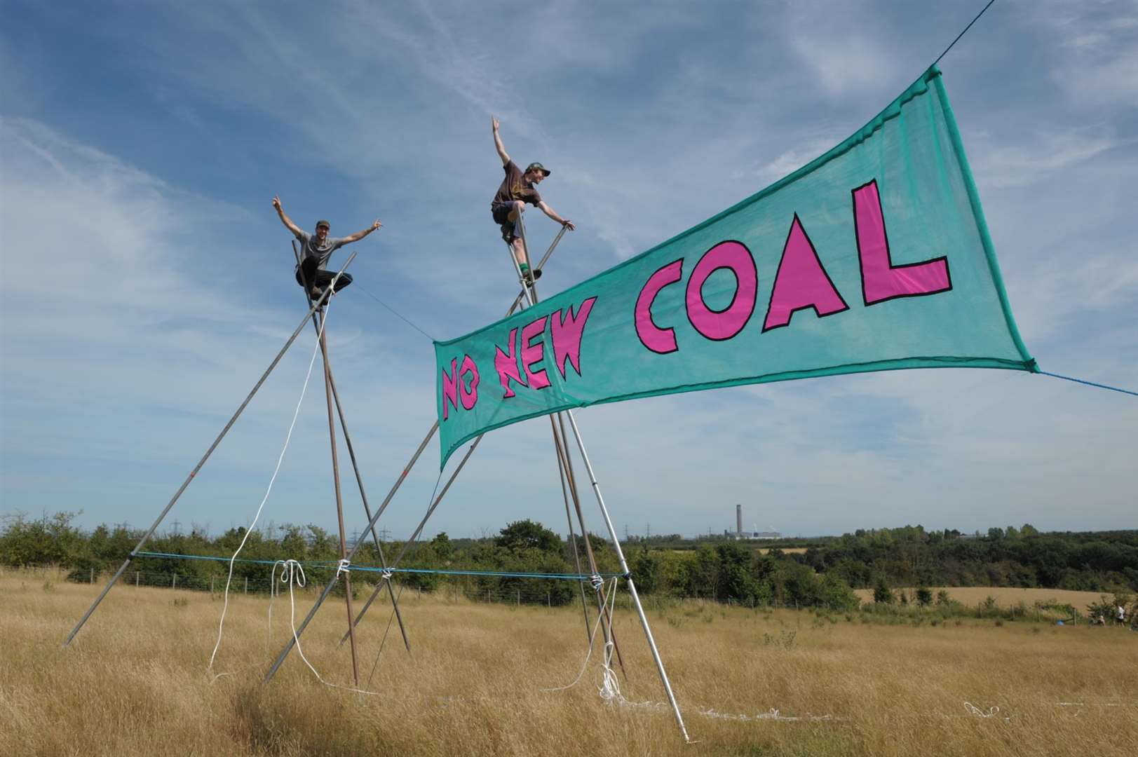 Banners go up between the tripods