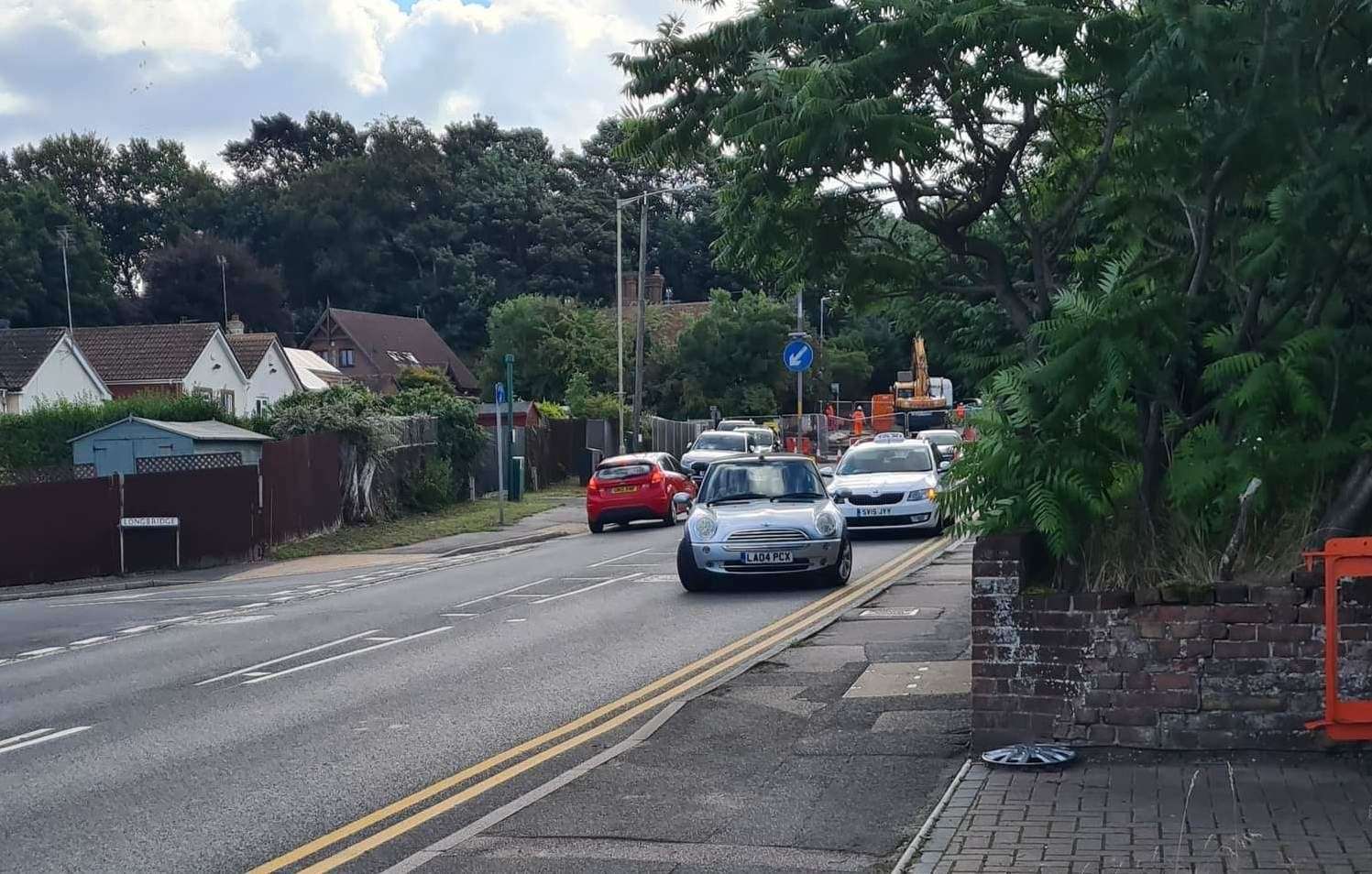 Cars are being forced to find a way around the road closure