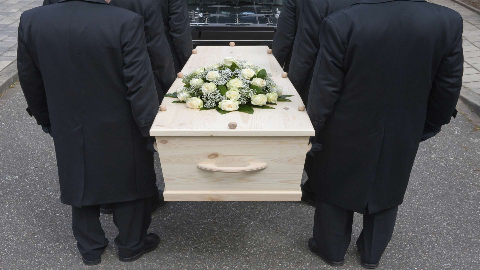 A coffin with flowers. Stock picture