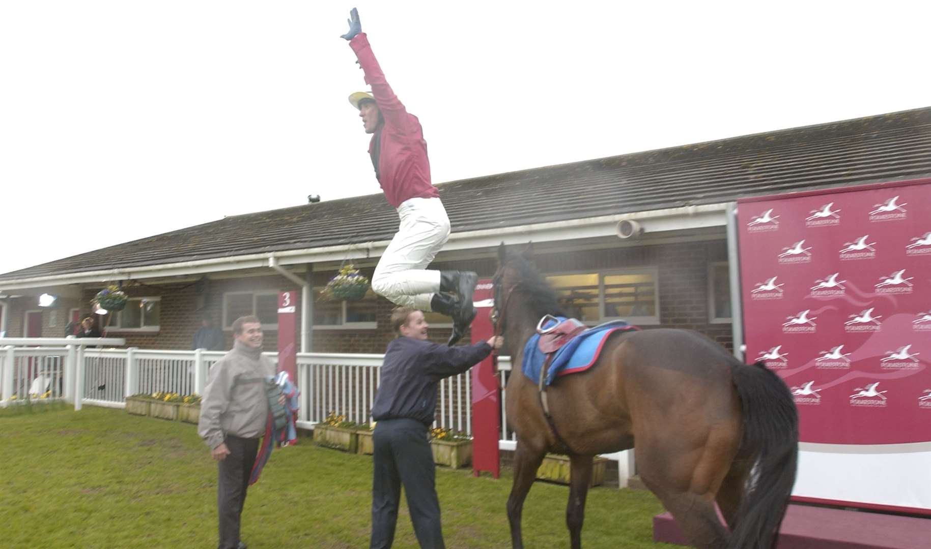 Frankie Dettori displays his trademark flying dismount celebration in April 2006