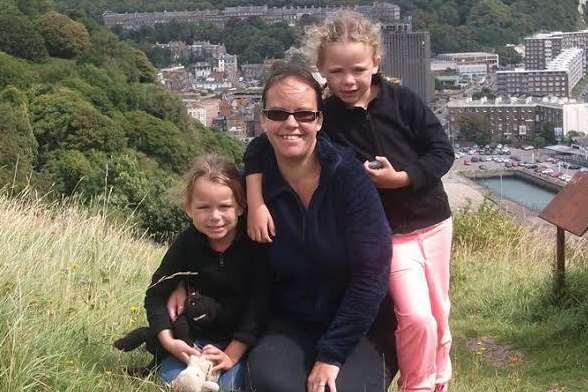 Sarah Bourne with her daughters Lucy, seven, and Amy, five