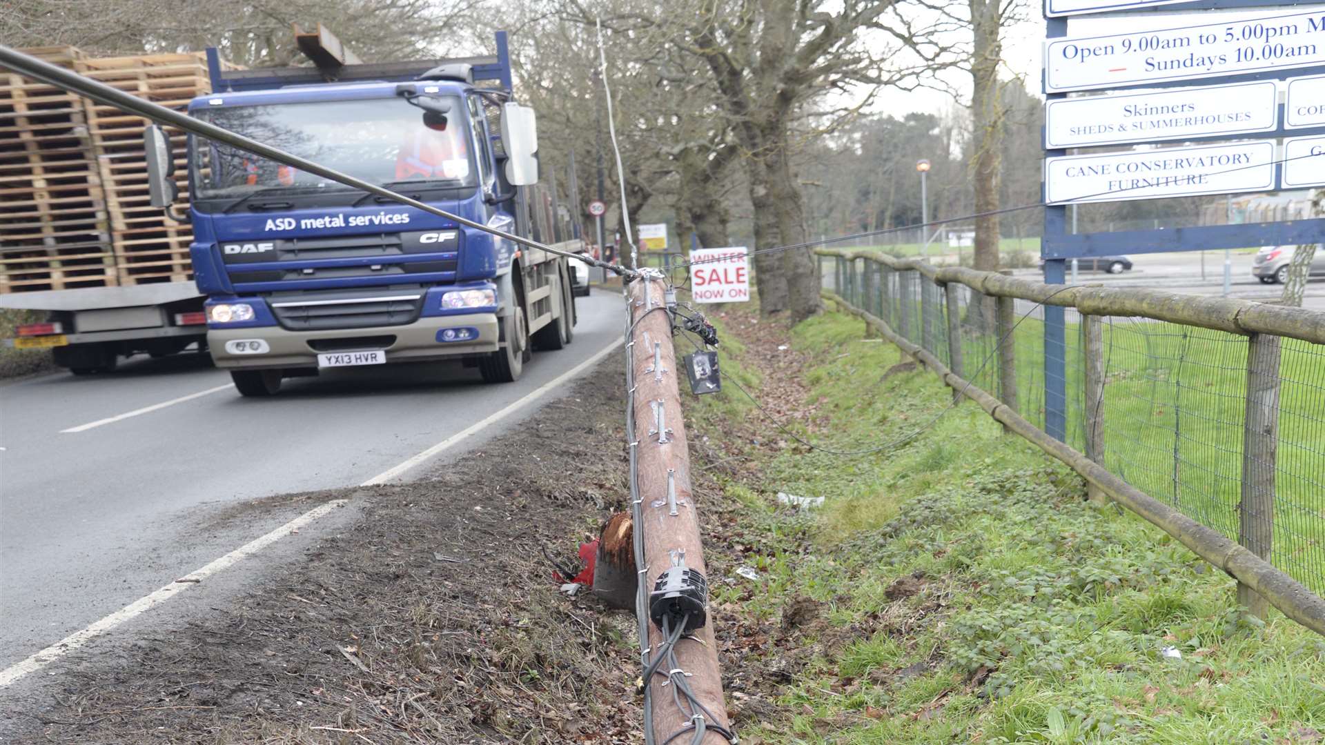 A telegraph pole appears to have been hit by the car