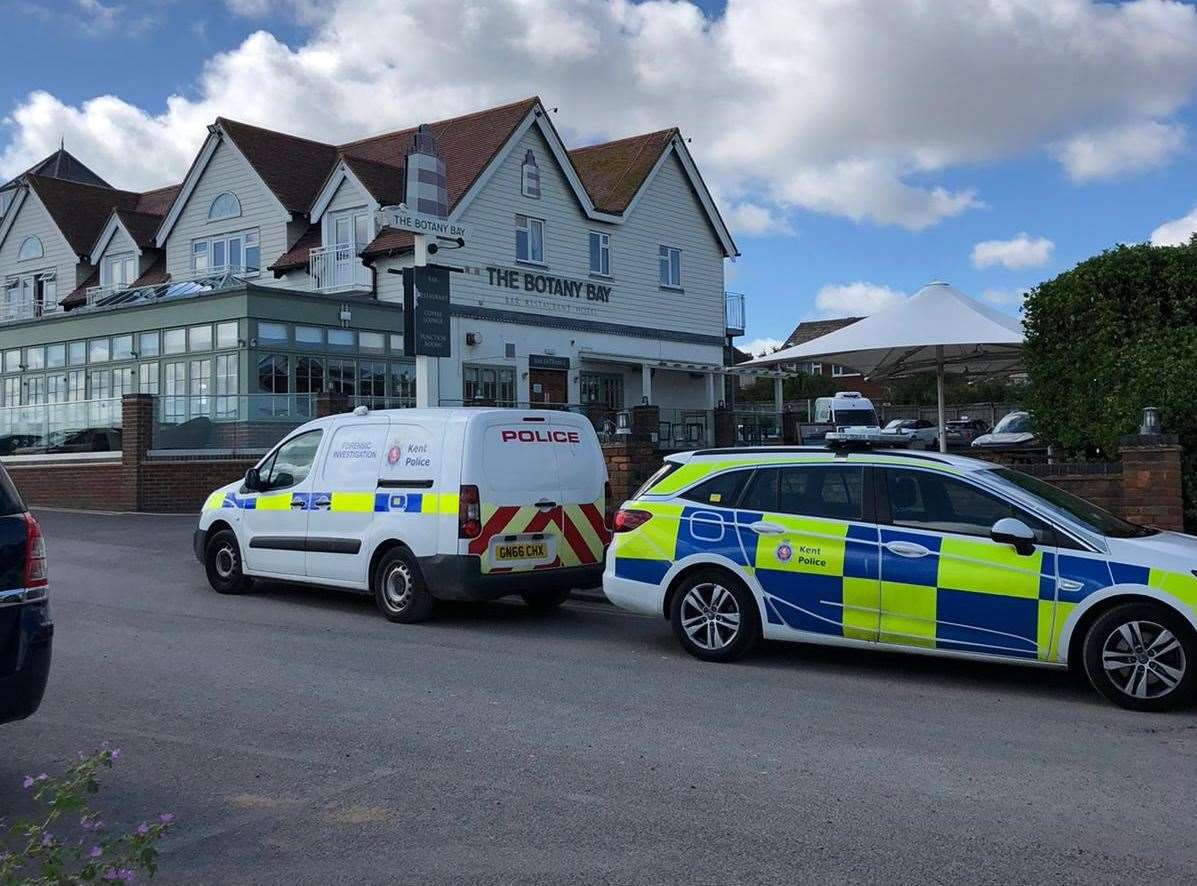 A number of emergency vehicles are parked up outside the hotel