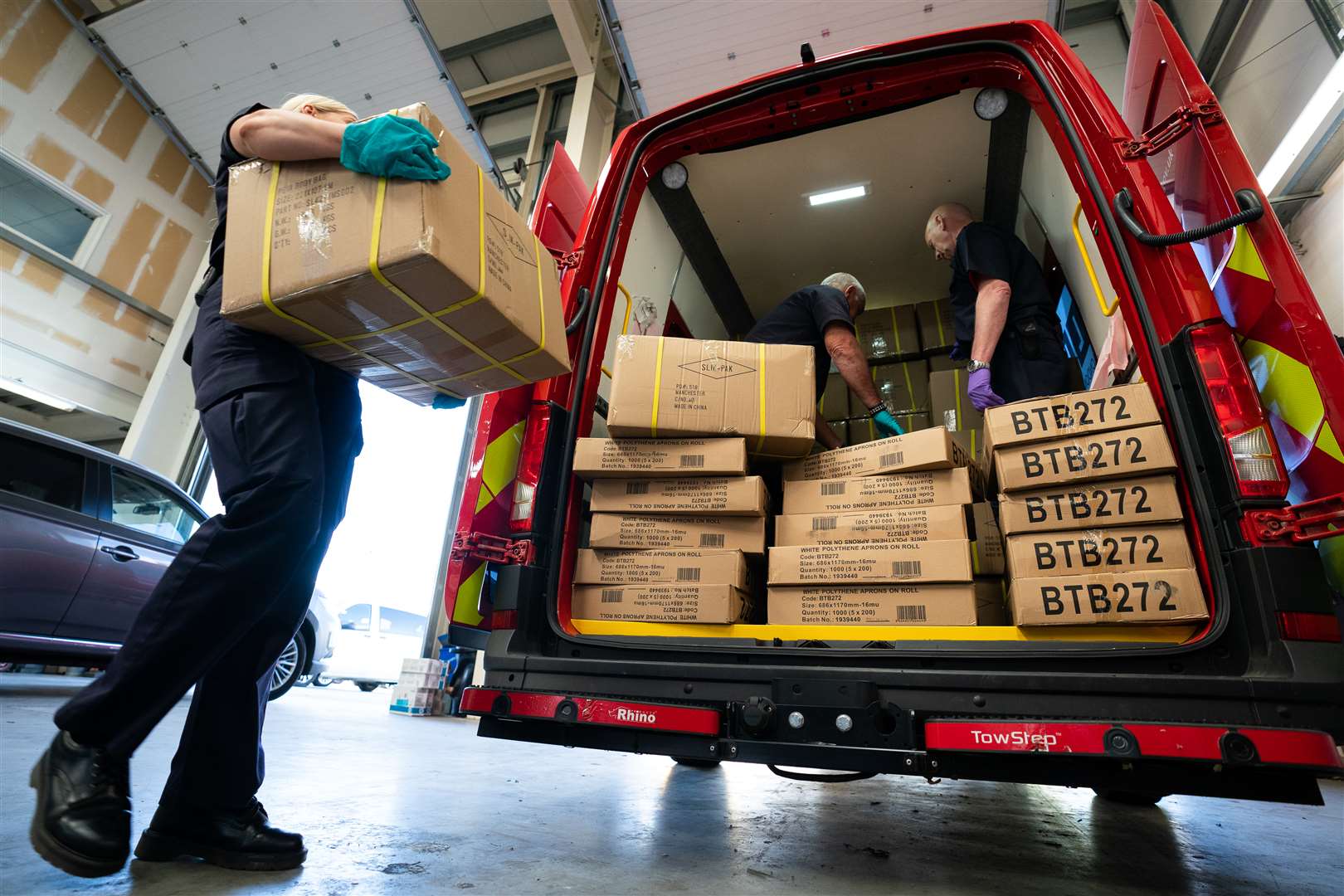 Staff from the London Fire Brigade load PPE at a location in south London (PA)