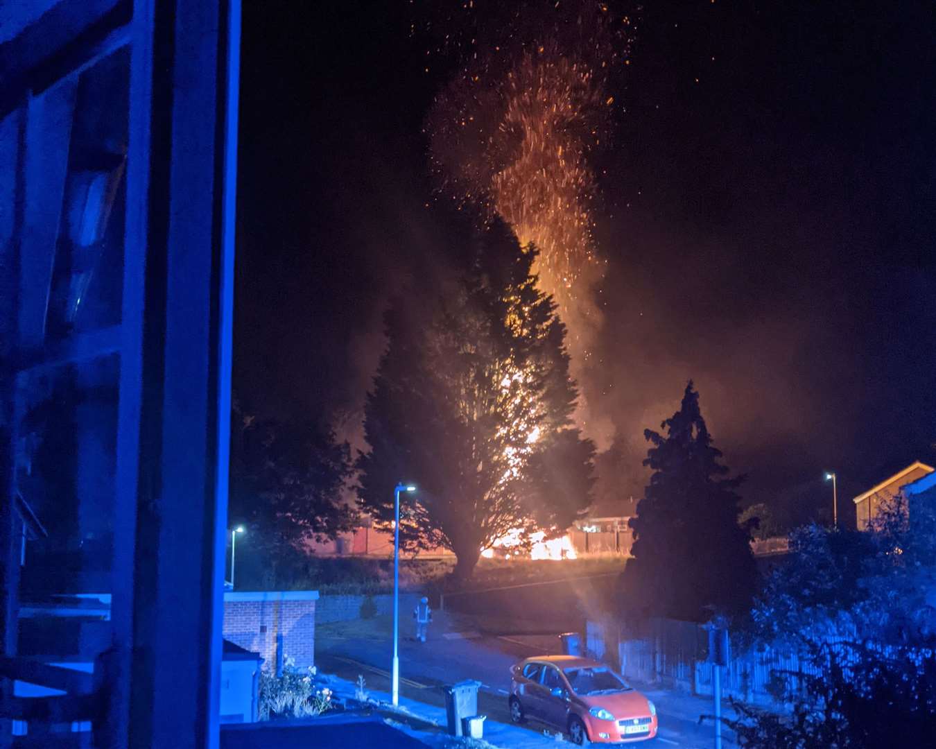 Flames soar into the sky after a car is set alight in Bishops Way, Canterbury