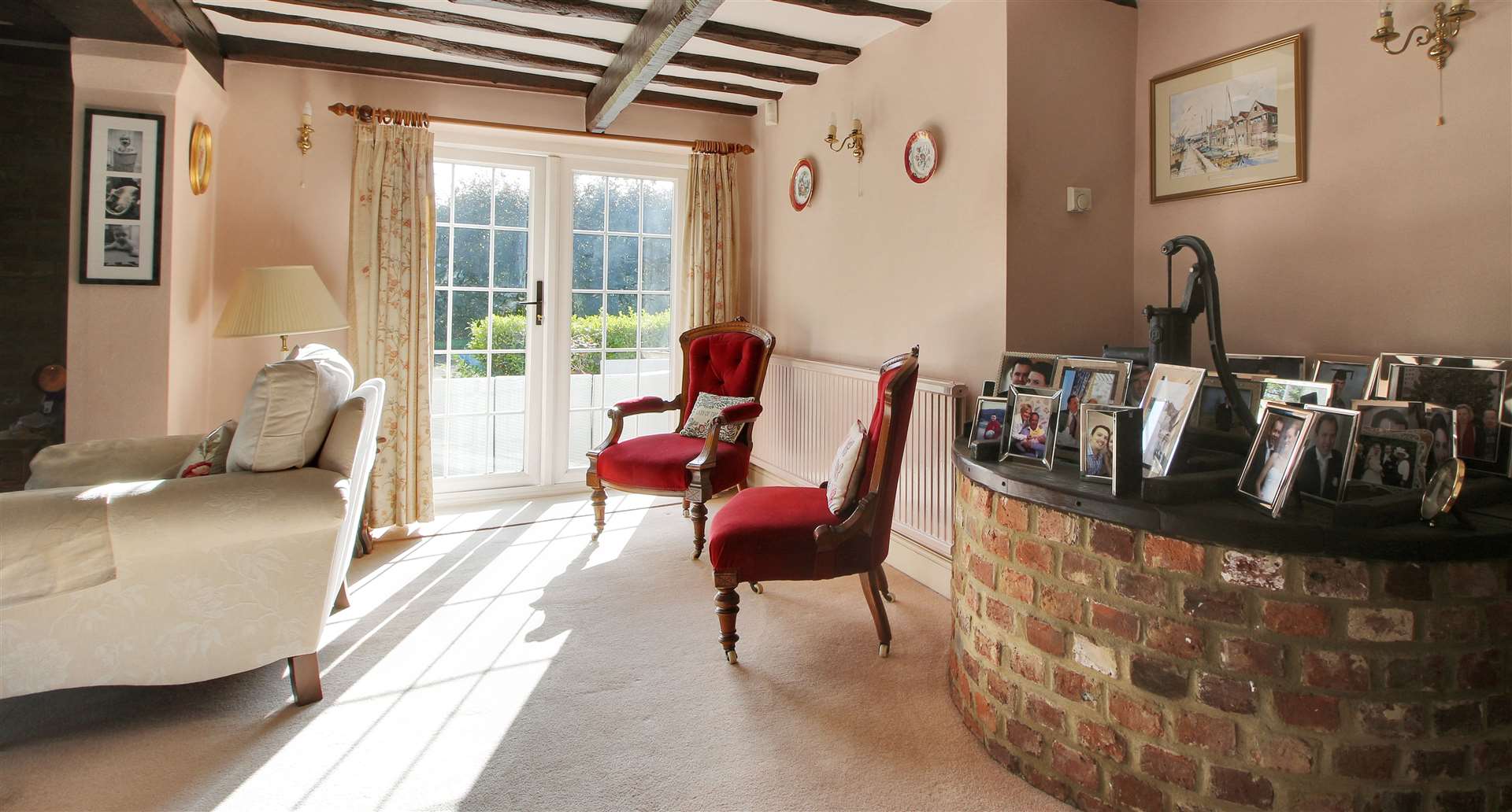 An original well, with pump, is in the corner of the sitting room