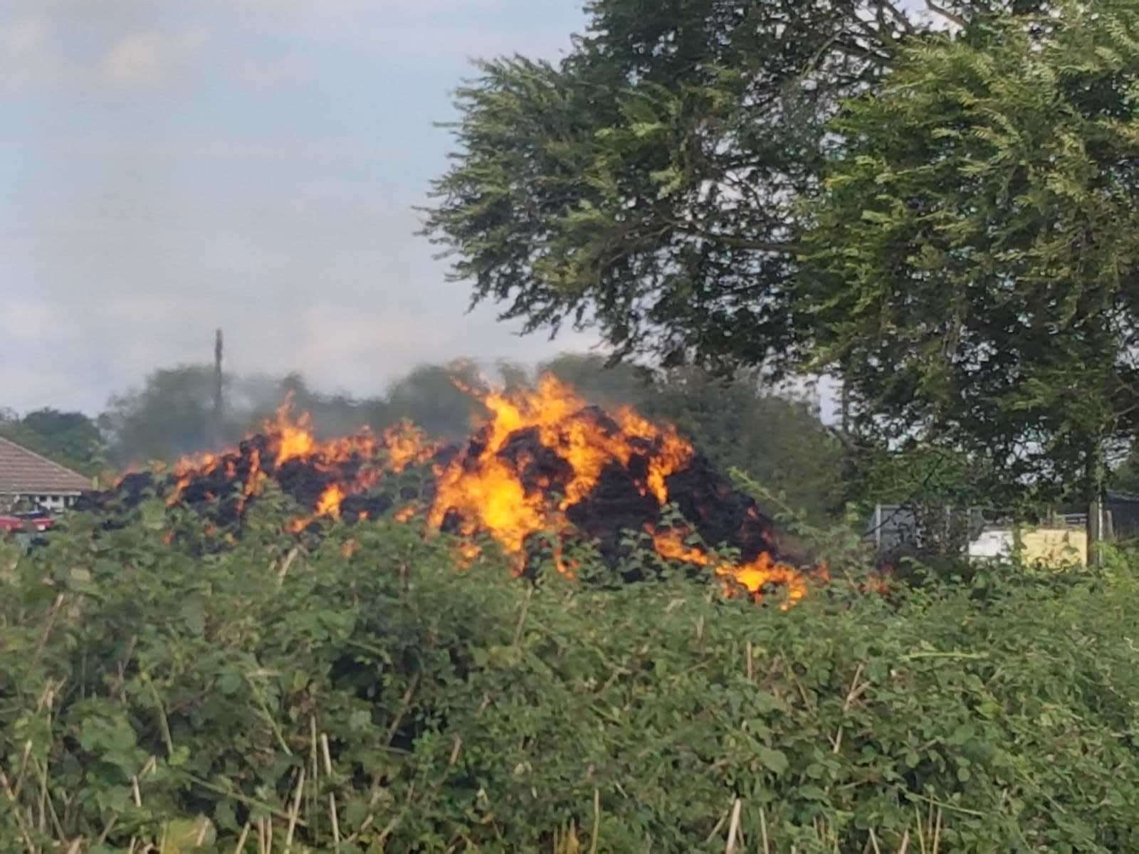 A hay bale fire, similar to this one in Challock last year, was started by a bonfire. Archive image