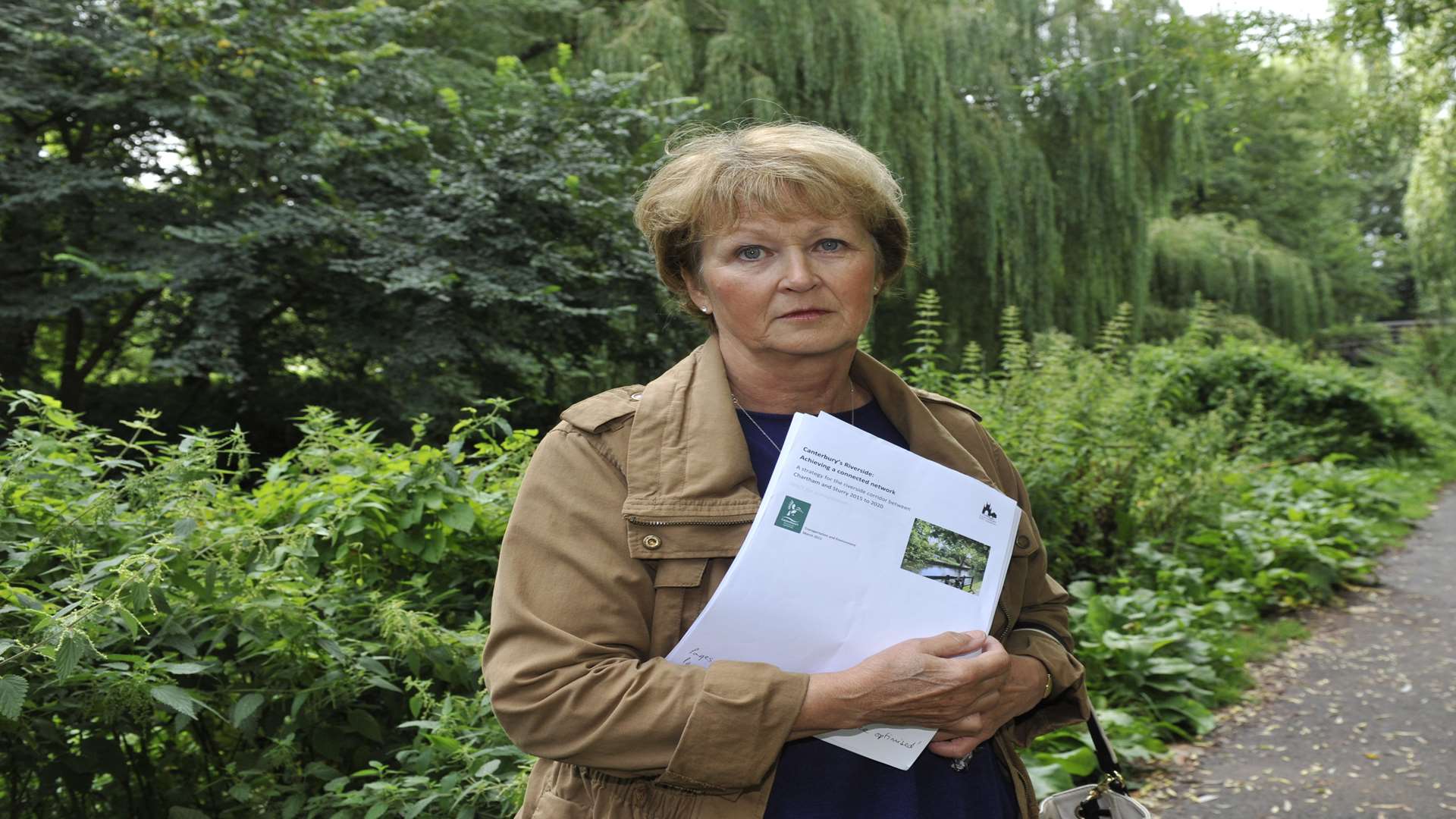 Lynette Coleman at Toddlers Cove, Canterbury, where weeds and nettles are becoming totally overgrown along the riverbank. Picture: Tony Flashman