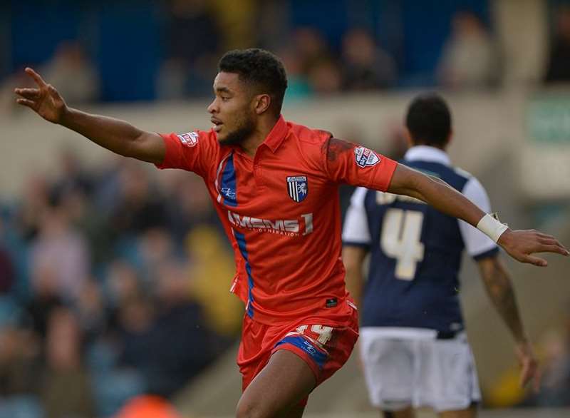 Dominic Samuel celebrates scoring Gills' first against Millwall