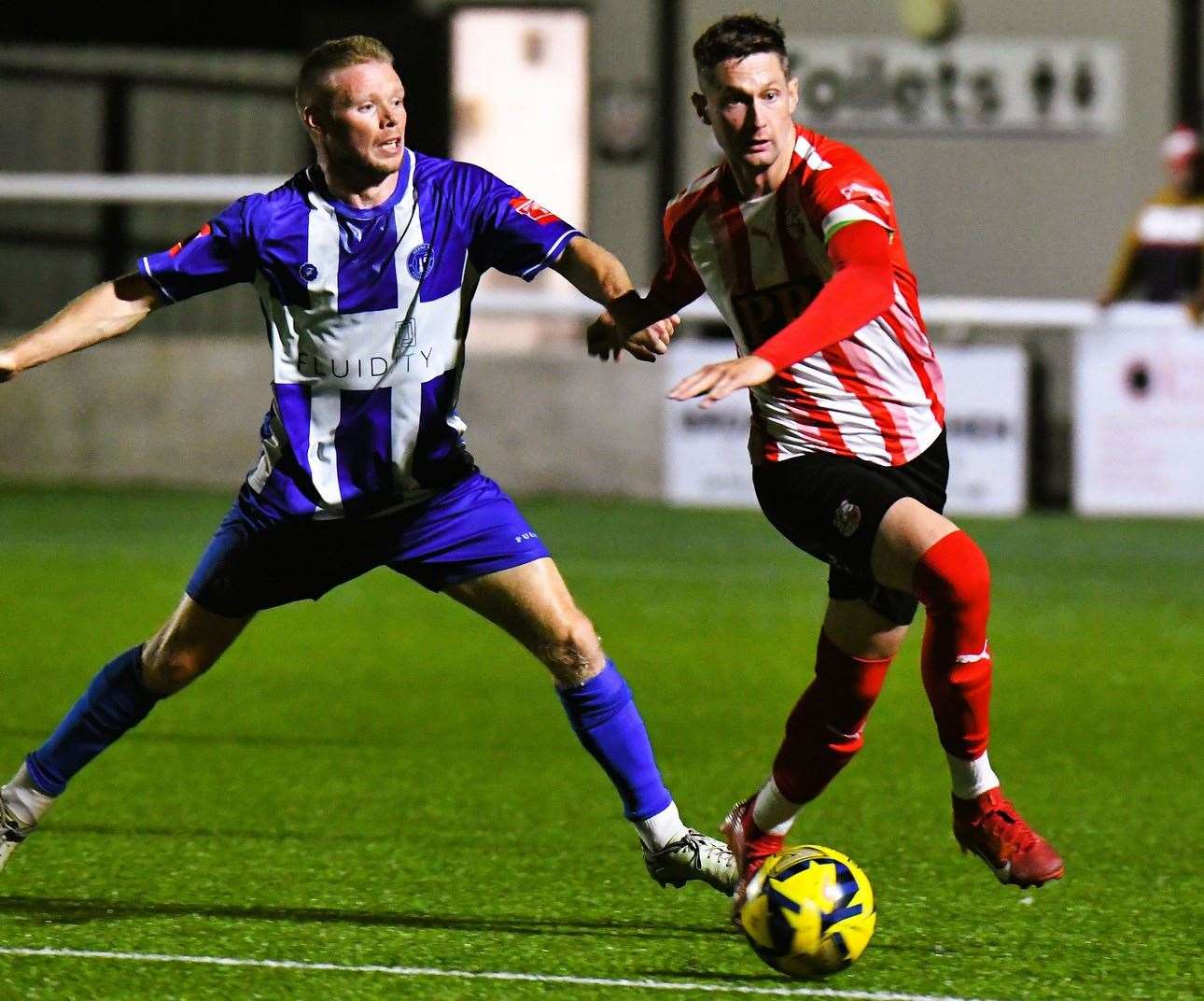 Herne Bay’s Scott Heard tries to stop Sheppey’s Dan Bradshaw during Tuesday’s Velocity Cup tie, which ended in a 5-4 shootout defeat after a goalless draw. Picture: Marc Richards