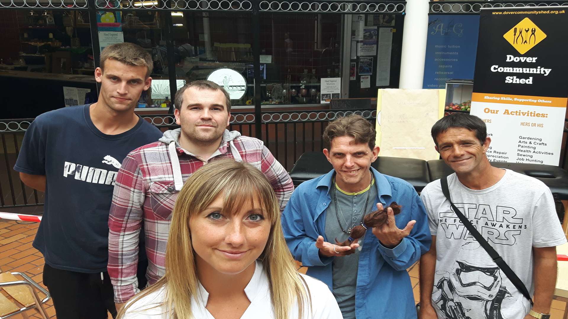 The Kelly Turner charity waxing. Beautician Jenny Hill with, from left, Mark Batson, Nathaniel Richards, John Manning, Neil Lee.