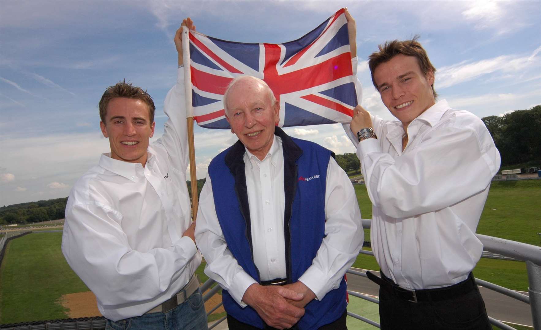 A1 Team GBR boss John Surtees with drivers Robbie Kerr and Alex Lloyd at Brands Hatch in 2005