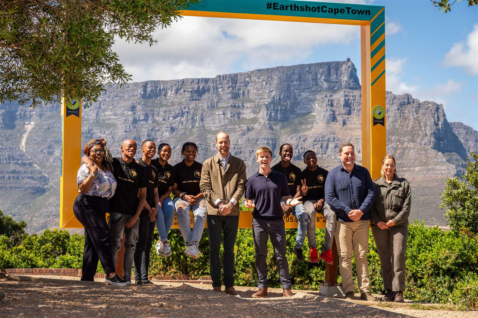 The Prince of Wales with youth conservation volunteers, Earthshot Prize Global Ambassador Robert Irwin and Geordin Hill-Lewis, Mayor of the City of Cape Town, during a visit to Signal Hill (Aaron Chown/PA)