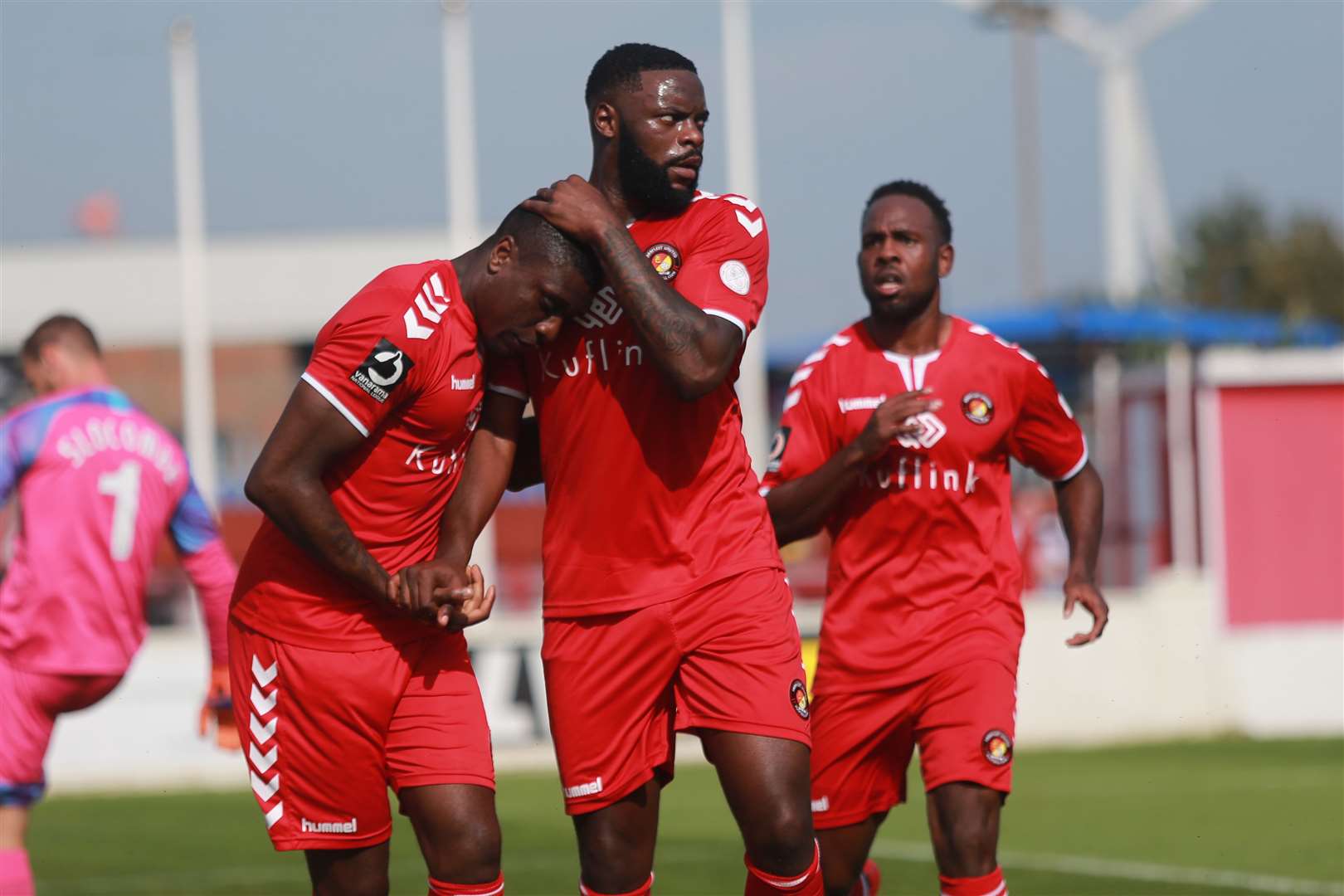 Josh Umerah celebrates his goal with Bondz N'Gala and Myles Weston Picture: John Westhrop