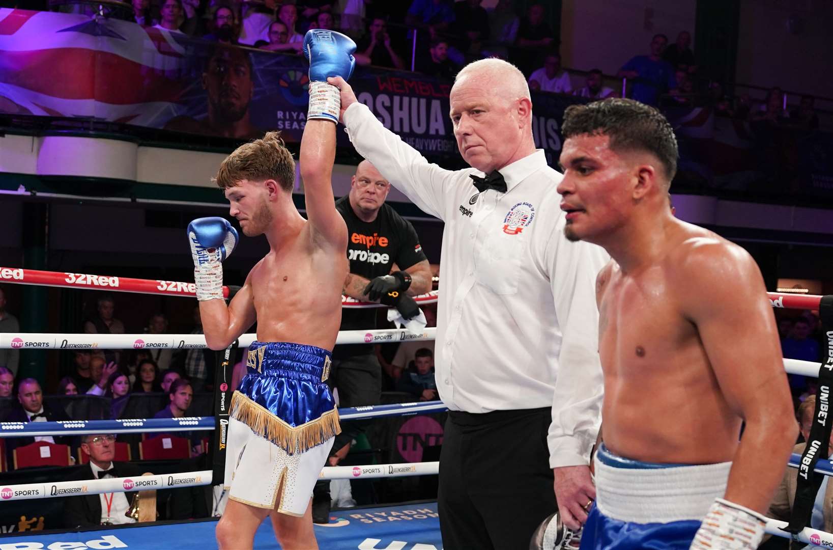 Referee Mark Bates holds Charlie Hickford’s arm aloft after beating Darwing Martinez on points Picture: Stephen Dunkley / Queensberry Promotions.