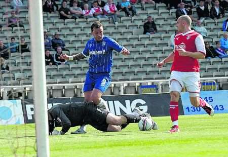 Danny Kedwell attempts to beat Rotherham keeper Conrad Logan.