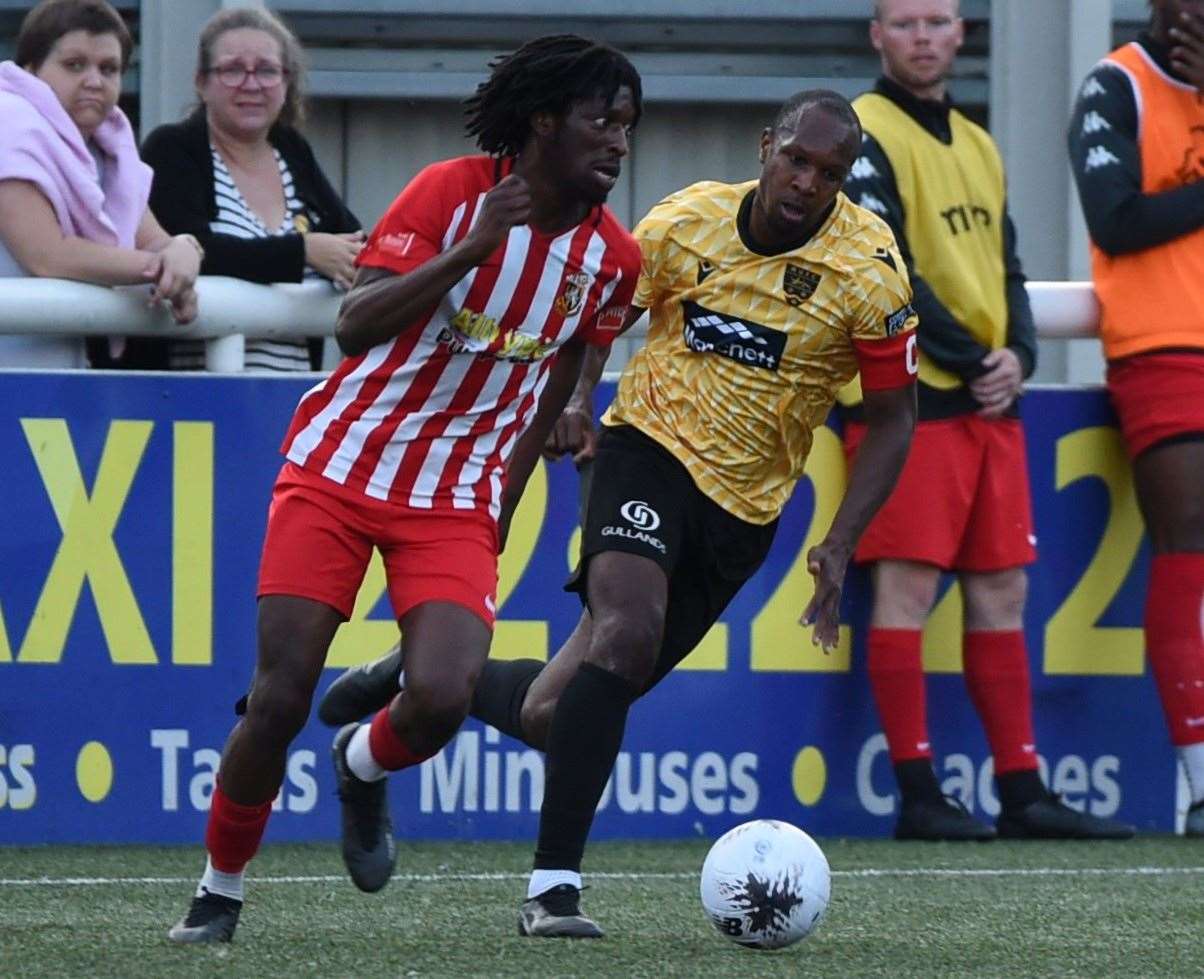 Maidstone skipper Gavin Hoyte tracks ex-United winger Andre Coker. Picture: Steve Terrell