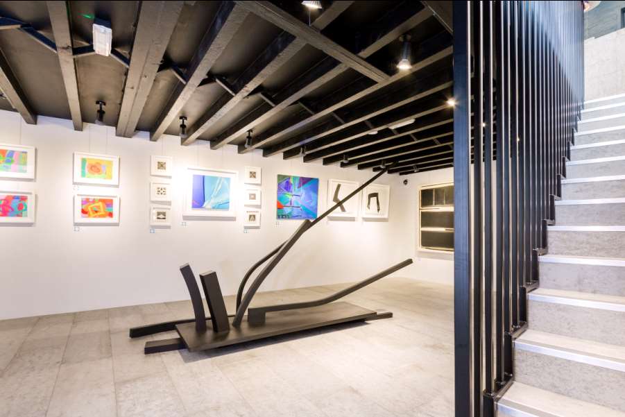 Chapel Place Gallery with Natural Grey Concreate flooring and staircase