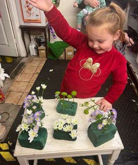 Michelle's granddaughter Frankie enjoying her first floristry lesson