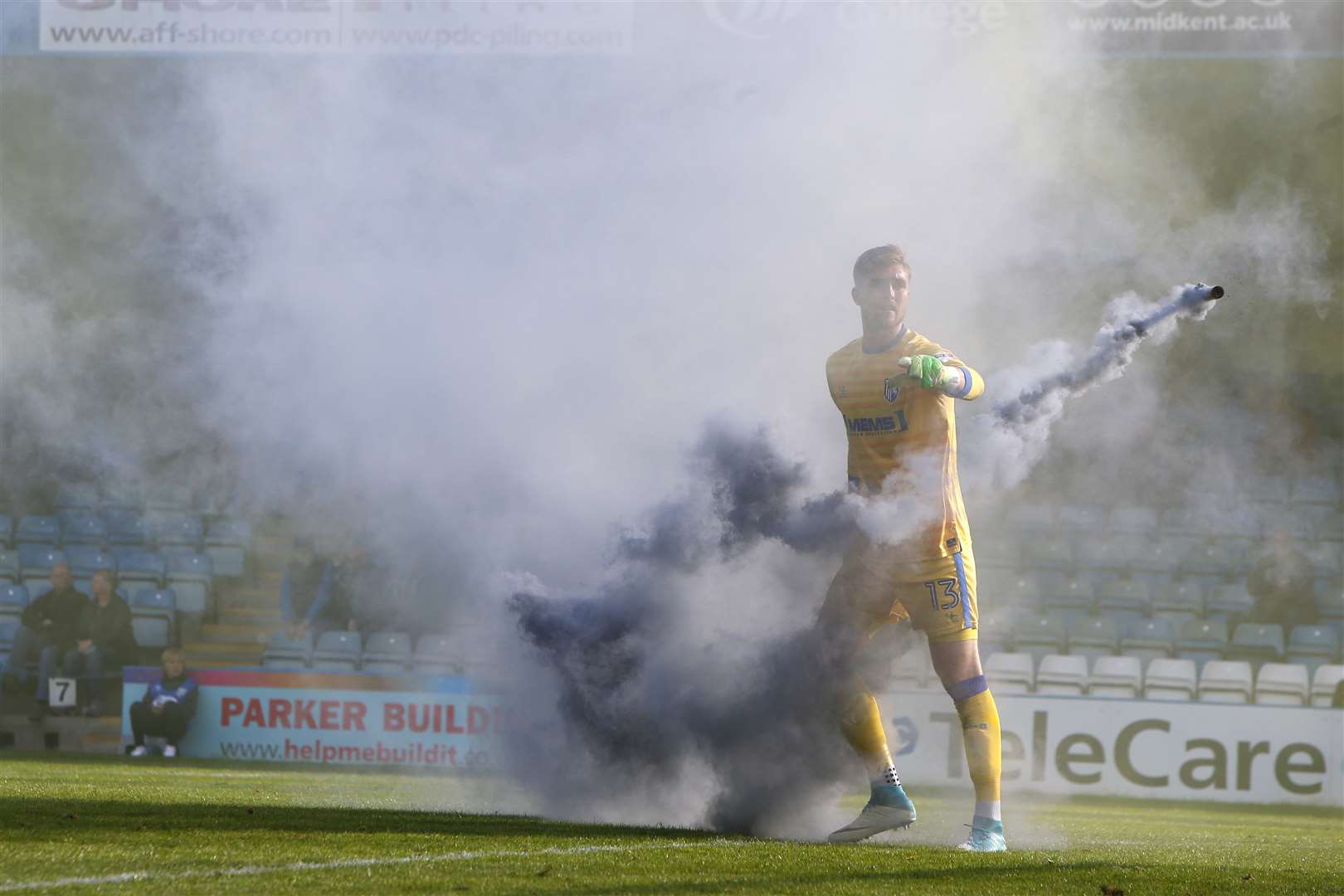 Tomas Holy throws a smoke bomb off the pitch. Picture: Andy Jones