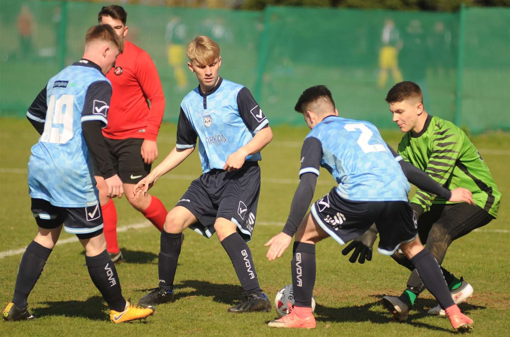 Rochester City under-18s (blue) defend in numbers against Rainham Kenilworth Rangers under-18s in the League Cup final. Picture: Steve Crispe FM8026755