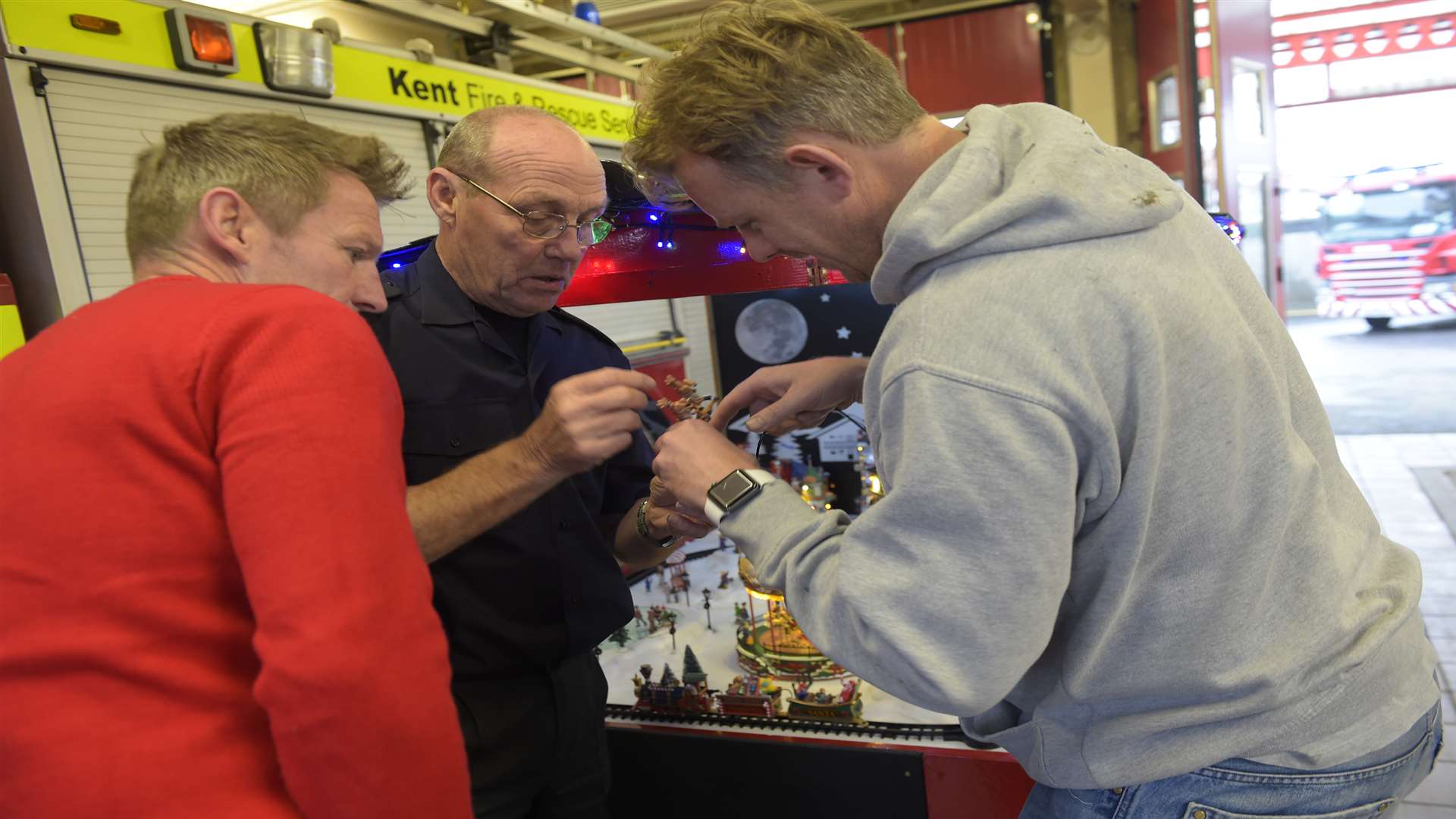 Last minute adjustments to the Christmas trailer's Christmas scene, made by firefighters at Deal