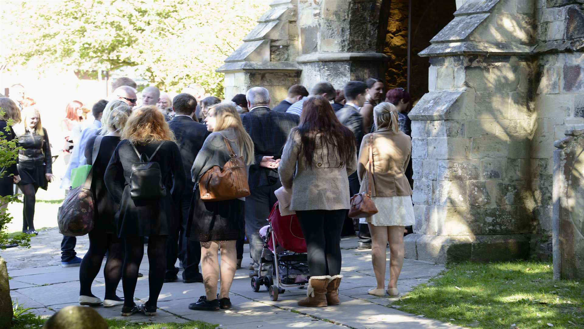 Friends of Jason Pettey gather outside St Mildred's Church, Tenterden, for the service.