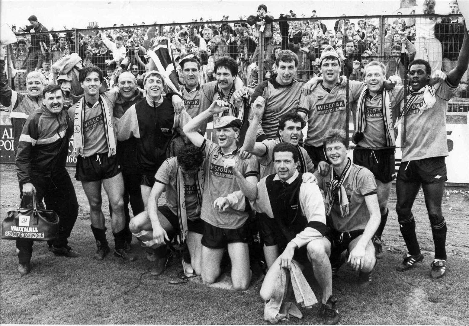 Maidstone players celebrate after learning they've won promotion to the Football League