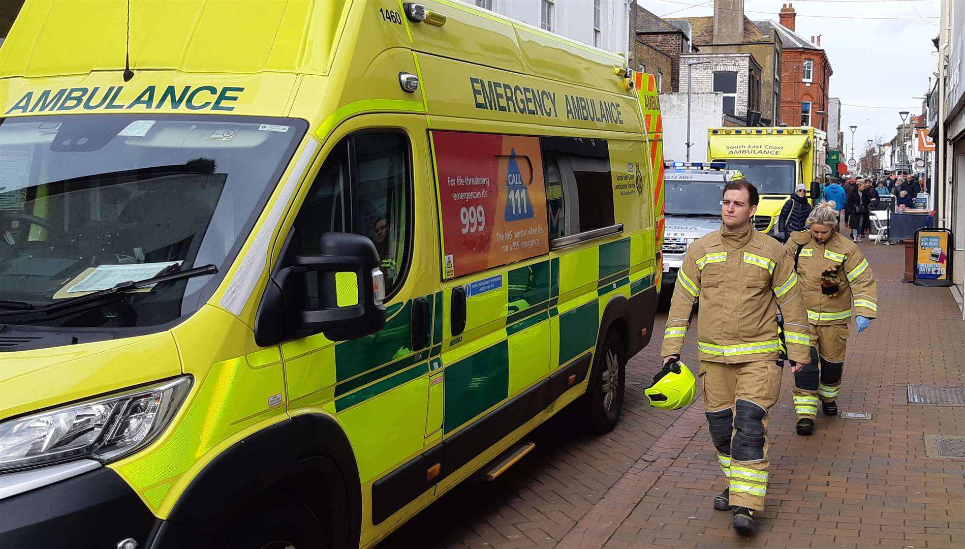 Firefighters at the scene, passing ambulance vehicles. Picture: Sam Lennon