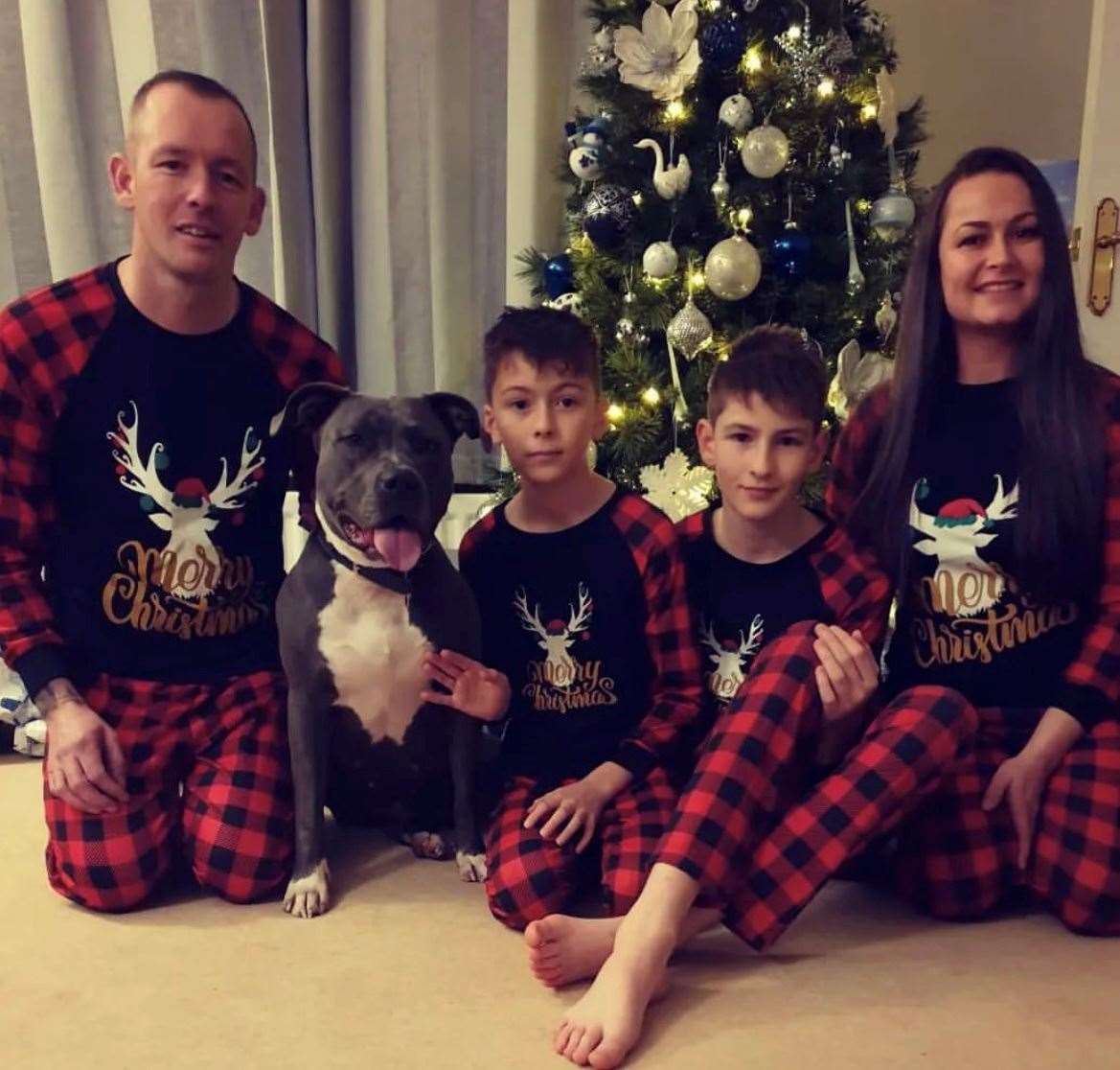 Darrell (left), Sam, Joe and Lindsey Beaumont from Kingsnorth in Ashford with their XL Bully, Rosie. Picture: Lindsey Beaumont