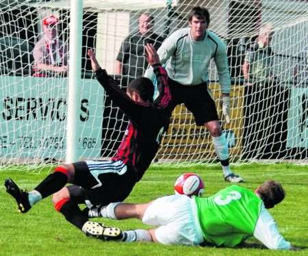 Sittingbourne's Hicham Akhazzan is felled by Whyteleafe's Sean Bremner to concede a late spot-kick