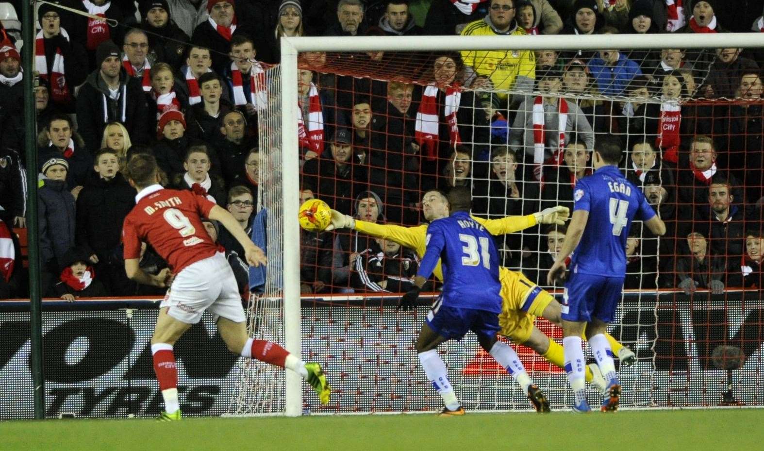 Keeper Stuart Nelson saved from Matt Smith, then of Bristol City, in a season where he scored seven against the Gills Picture: Barry Goodwin