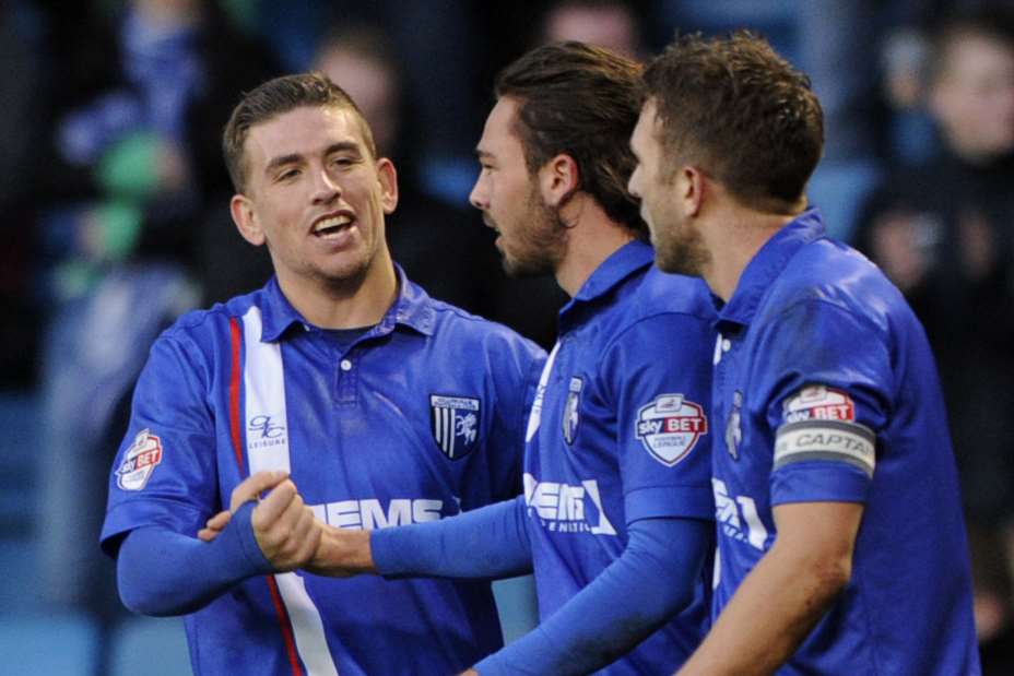 Bradley Dack is congratulated on his winner against Oldham Picture: Barry Goodwin