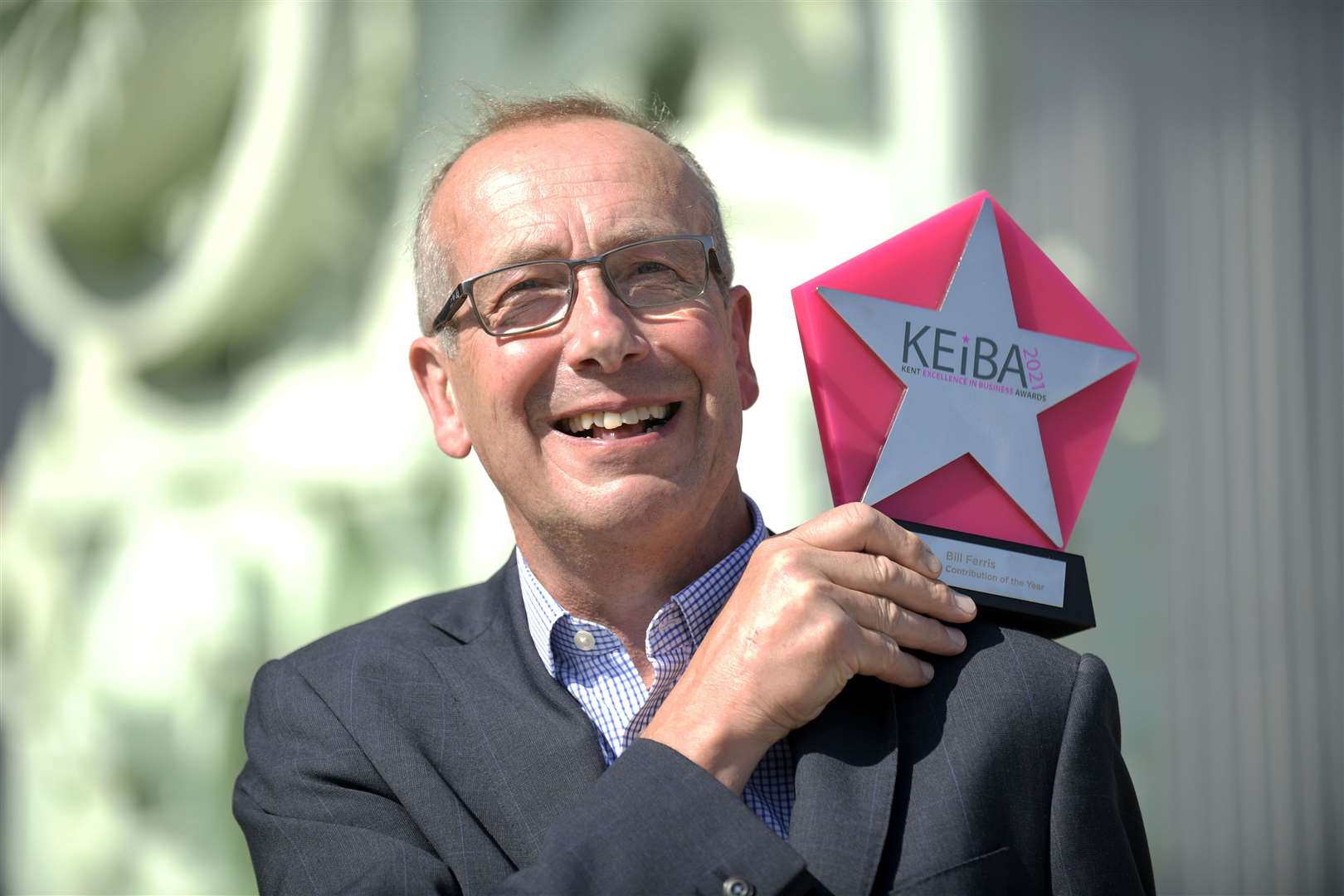 Bill Ferris, the former chief executive of Chatham Historic Dockyard, receiving his award