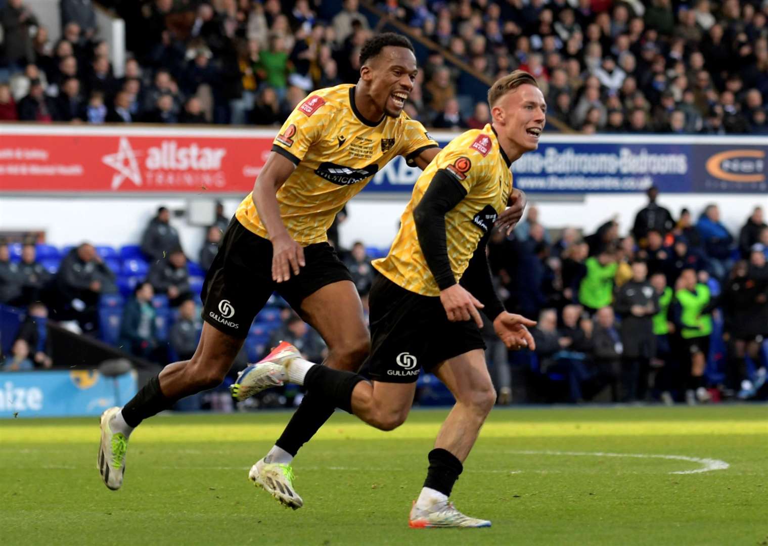 Maidstone’s Sam Corne wheels away after scoring what proved the winner at Ipswich on Saturday – they now travel to Sheffield Wednesday or Coventry in the last 16. Picture: Barry Goodwin