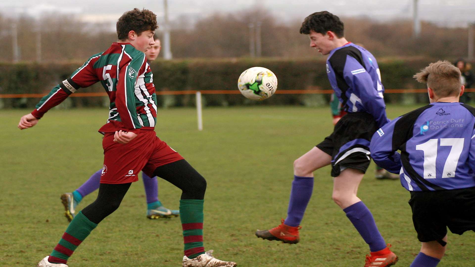 Anchorians United under-15s and rivals Cobham Colts go for a 50-50 ball Picture: Phil Lee