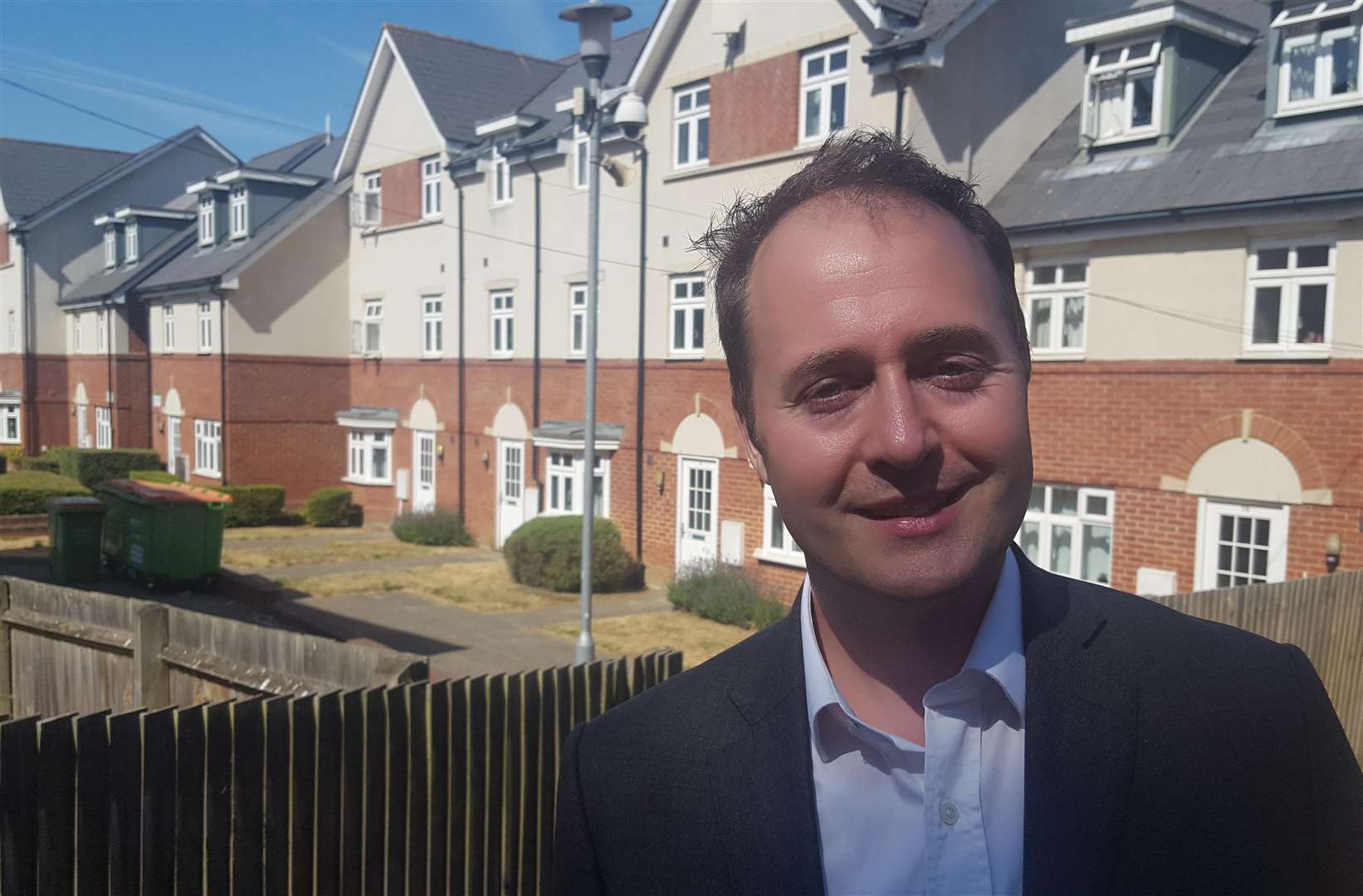 Council leader Simon Cook with some of the former student houses the city council has bought (3677277)