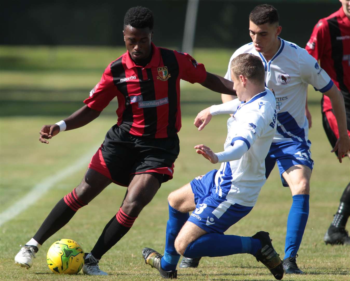 Ira Jackson takes on Bearsted duo Cameron Croucher and Reece Collins. Picture: John Westhrop