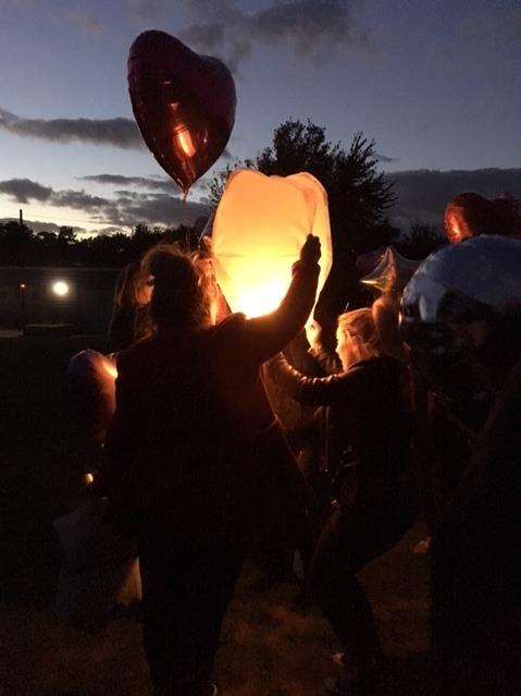 Balloons were let off into the night