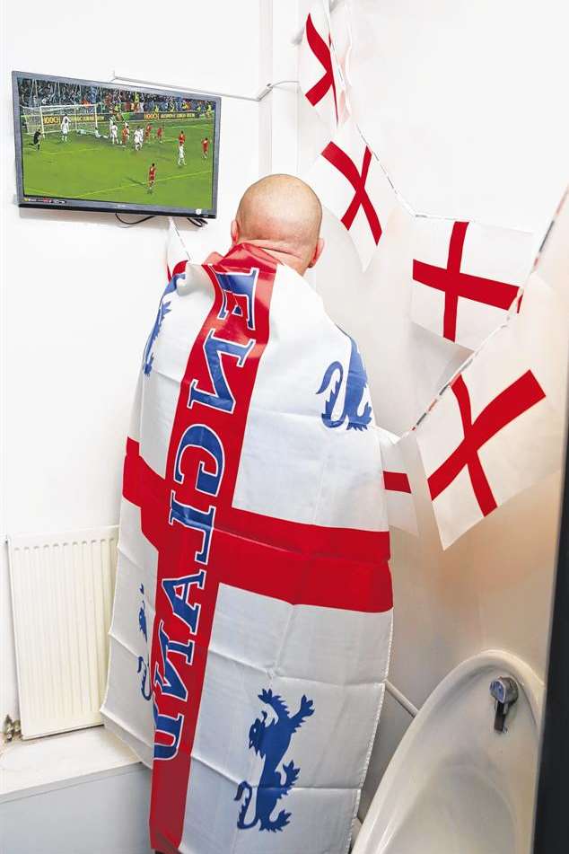 A TV has been set up in the loo at the Red Lion so no-one misses the action