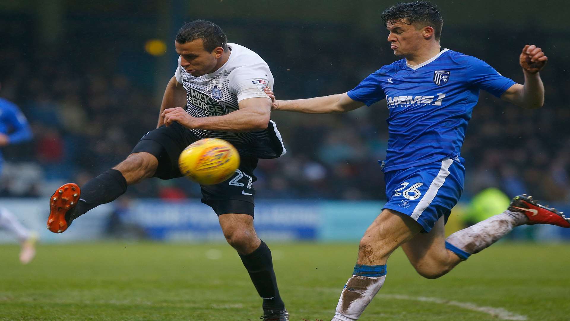 Gills' Callum Reilly closes down Steven Taylor, of Peterborough. Picture: Andy Jones