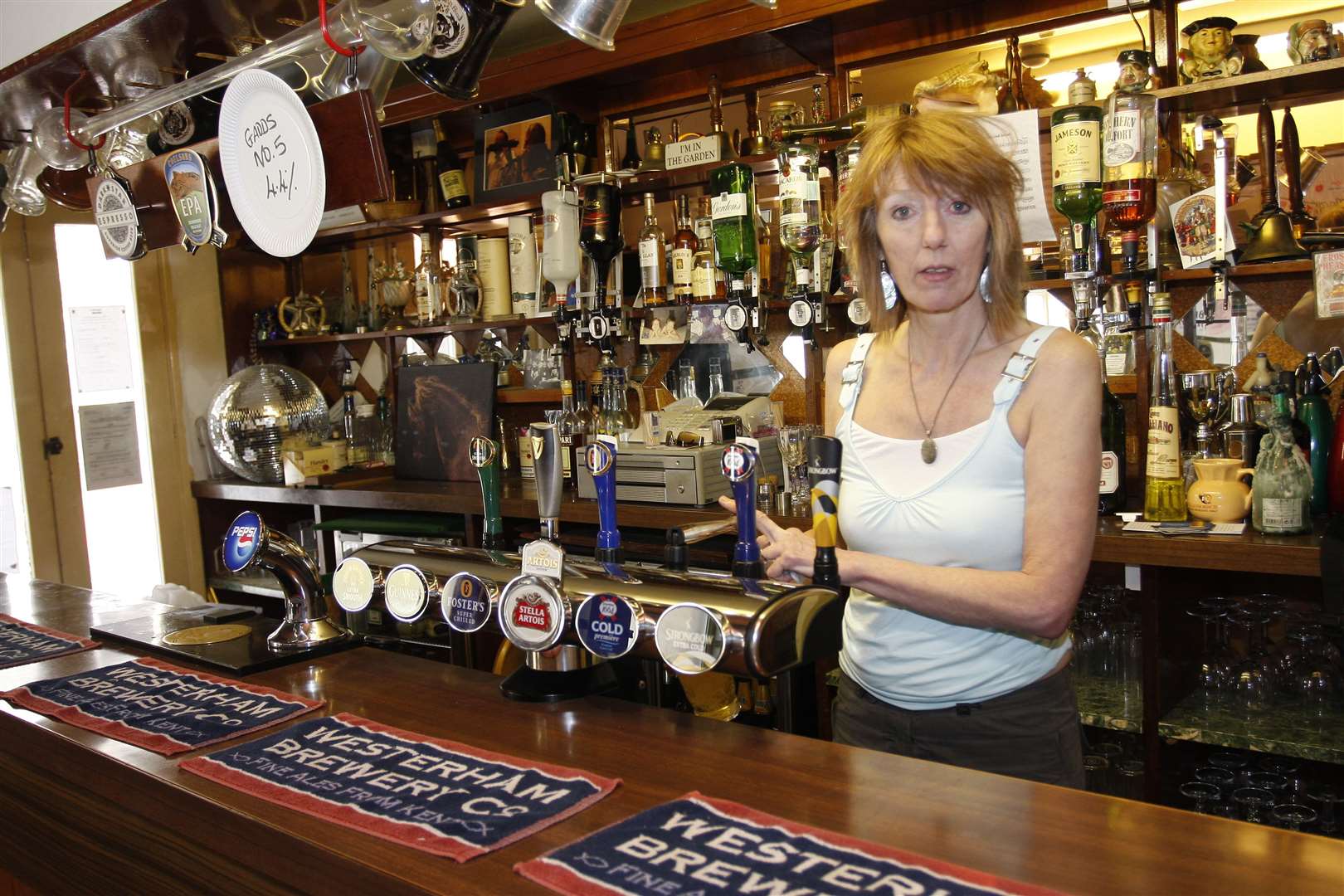 Karen Weobley behind the bar in April 2009