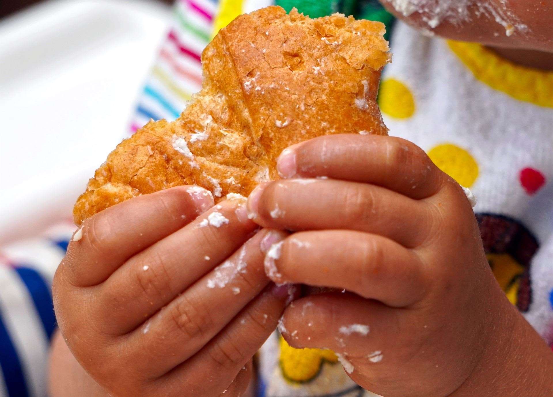 A child eating a sugary snack