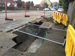 The damage to the pavement and water pipe outside their home in Ramsgate, thought to be caused by a sinkhole. Picture: Marilyn Stapleton