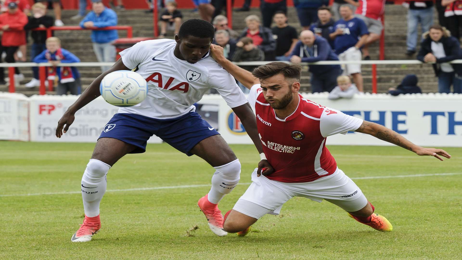 Jack Payne gets to grips with former Fleet player Shilow Tracey Picture: Andy Payton