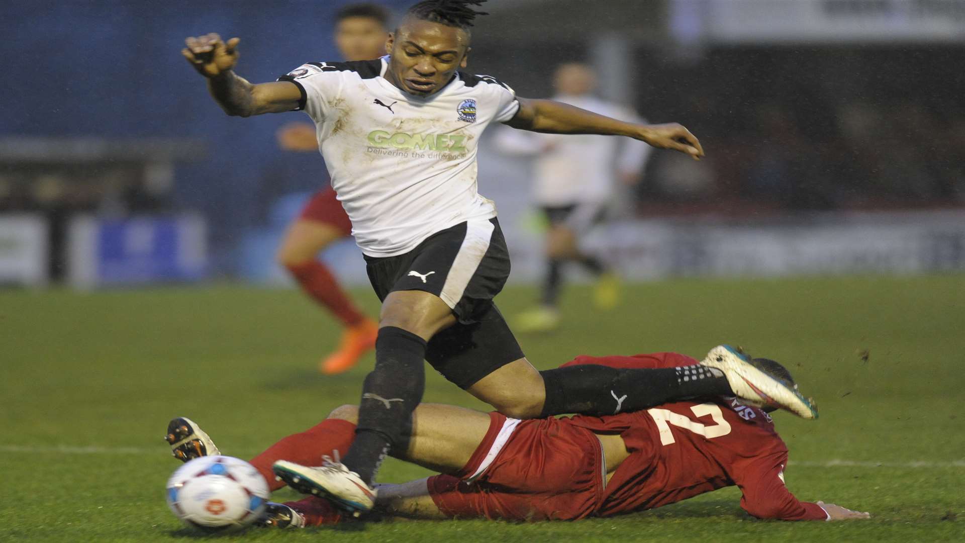 Dover's Aswad Thomas is tackled by Welling's Reece Harris. Picture: Tony Flashman